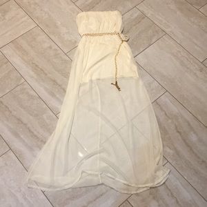 Creme-colored strapless maxi dress with chain belt